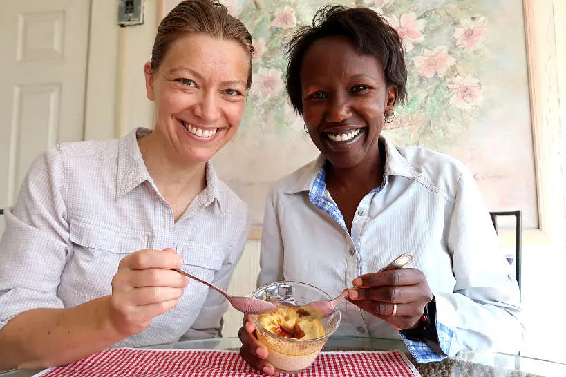 Claire and Rosemary eating homemade jericalla dessert for food in Guadalajara