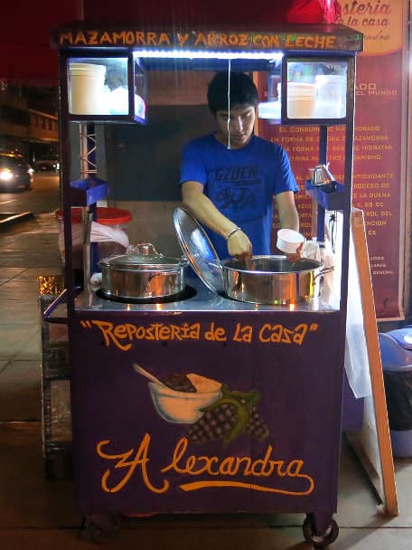 Peruvian vendor selling mazamorra morada in Lima by Authentic Food Quest